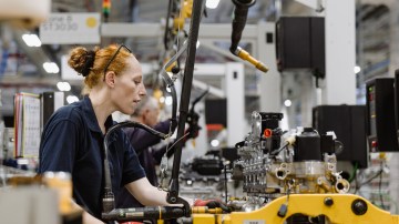 A worker in the Jaguar Land Rover Wolverhampton factory restarting work after a cyber attack.
