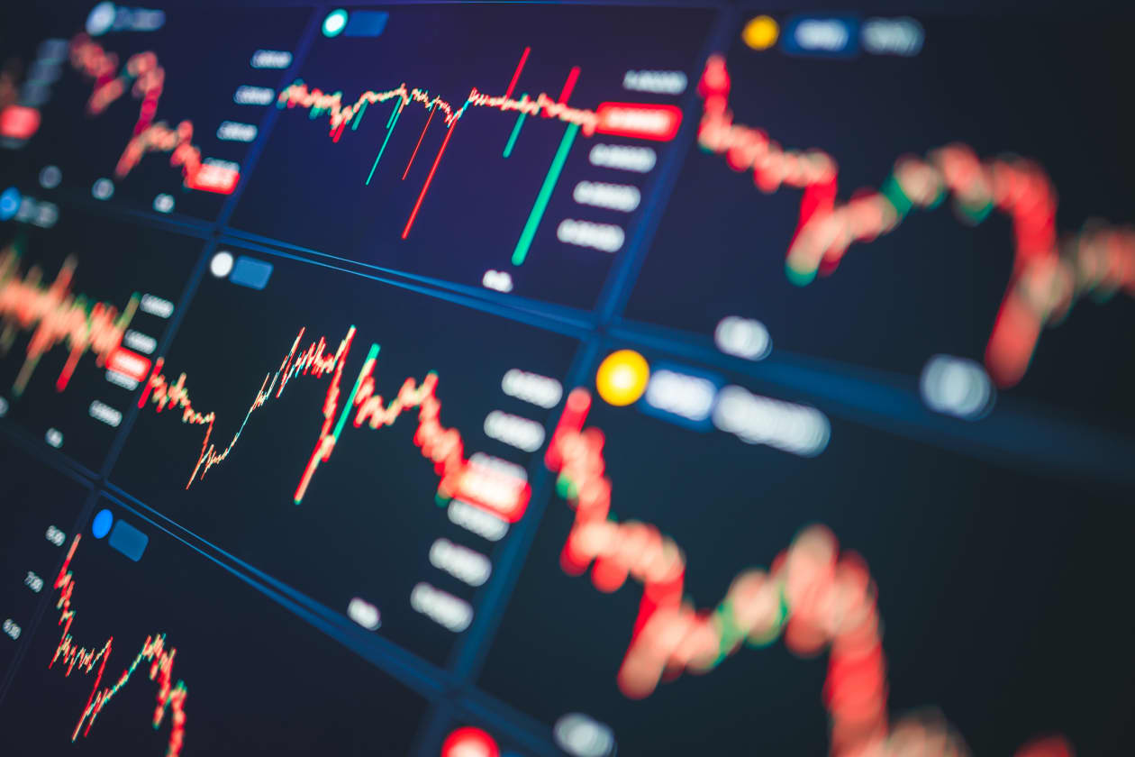 Multiple financial charts displaying fluctuating stock market data.