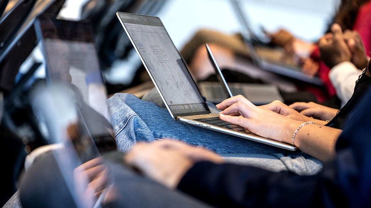 Students use laptops.