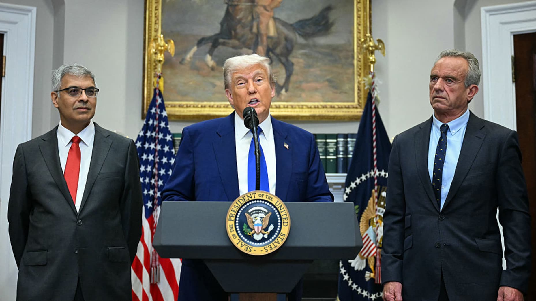 US President Donald Trump (C), alongside Secretary of Health and Human Services Robert F. Kennedy Jr. (R) and National Institute of Health (NIH) Director Jayanta Bhattacharya (L), speaks during a news conference about prescription drug prices, in the Roosevelt Room of the White House on May 12, 2025, in Washington, DC. (Photo by Jim WATSON / AFP) (Photo by JIM WATSON/AFP via Getty Images)